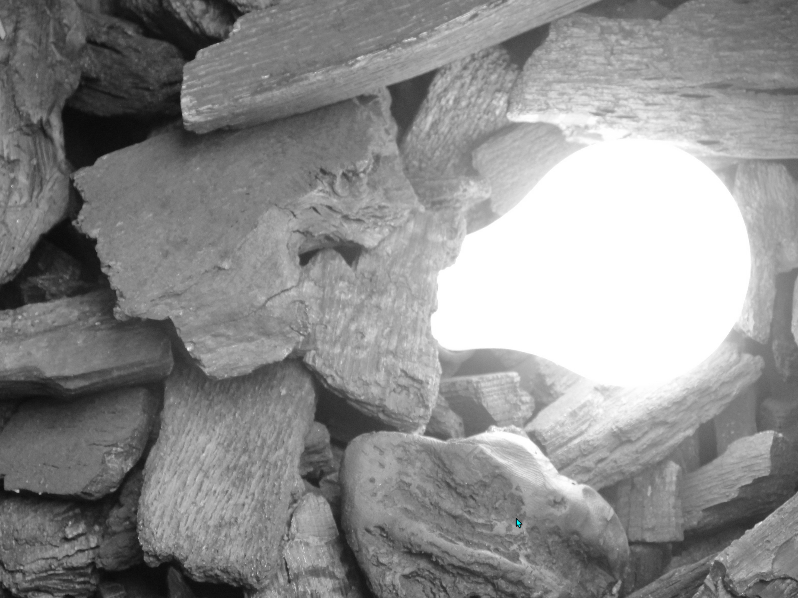 An idea emerging as light through a bed of coal